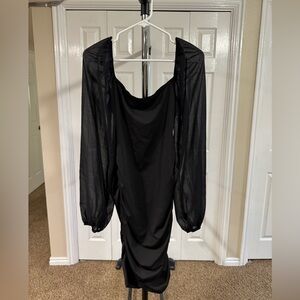 Elegant Black Dress with Sheer Sleeves